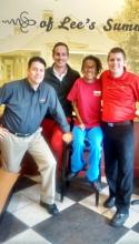 Tionna pictured with her managers from McAlister's Deli.